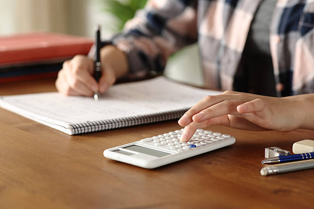 Student hands using scientific calculator stock photo