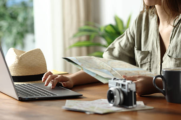 istock Tourist preparing holiday checking laptop and maps 2218206775