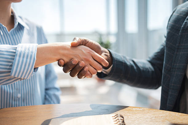 istock Professional handshake between business individuals in a bright modern office setting 2218206870