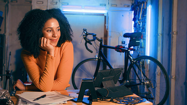 istock Young Woman in Workshop Planning While Enjoying a Relaxing Moment 2218207541