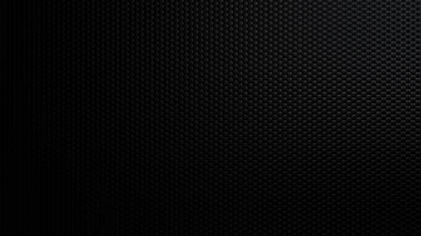 istock Dark and elegant black carbon fiber texture background with a subtle hexagonal pattern and a gradient light effect 2218207644