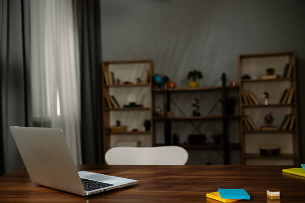 istock Modern Cozy Workspace with Open Laptop on Wooden Desk 2218208747