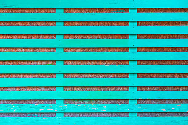 a green wooden fence fence to the shore of the Mediterranean Sea