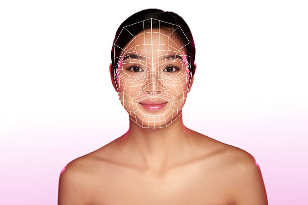 istock Facial analysis technology highlights a woman's features in stylized geometric overlay at a digital art exhibition 2218220576