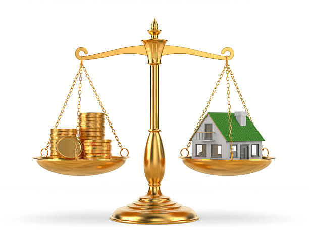 istock house and money on scale. Isolated 3D illustration on white background 2218220924