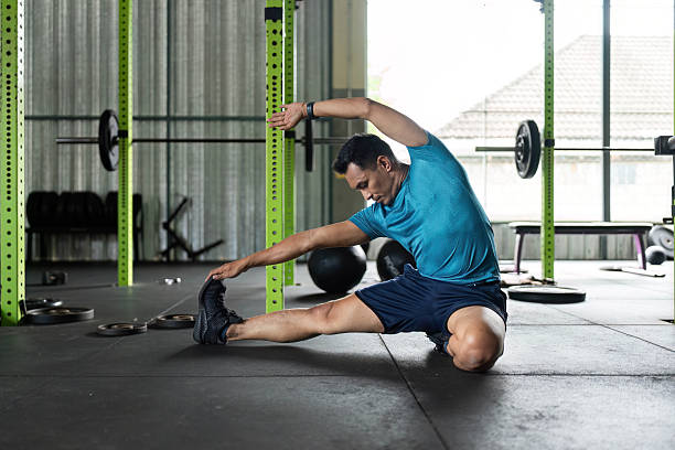 istock Fitness and Flexibility. Man stretching in a gym for improved mobility. 2218221145