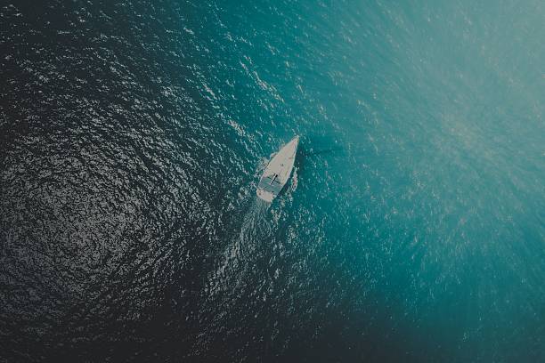 istock Aerial view of sailboat on blue ocean. 2218222013