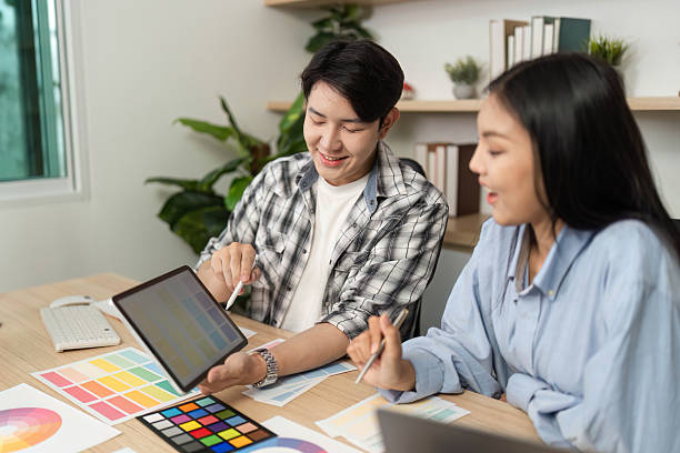 istock Collaborative UX and UI Design Session. Designers reviewing ideas on a tablet. 2218225870