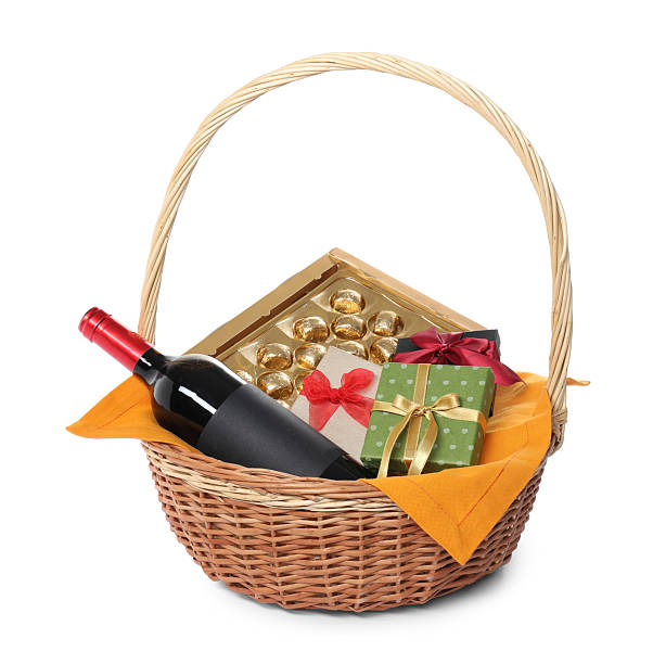 istock Wicker gift basket with wine isolated on white 2218229820