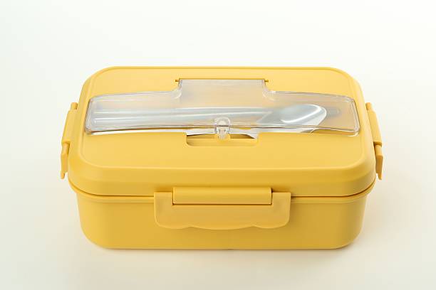 istock Yellow lunch box with cutlery isolated on white 2218230061