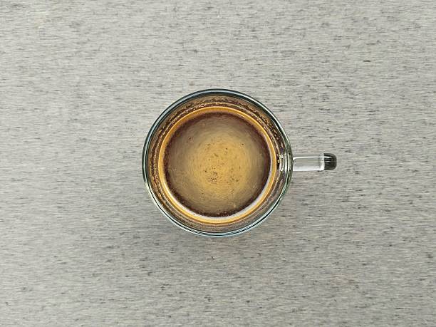 Black coffe in glass on grey background
