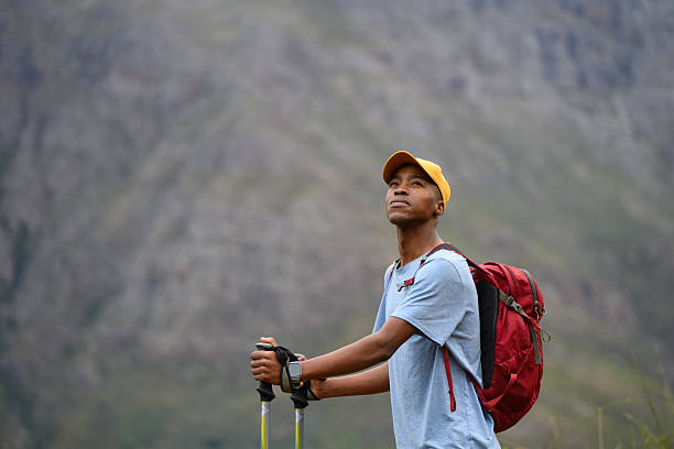 istock Solo hiker exploring mountains with a focus on goal setting and freedom 2218236248