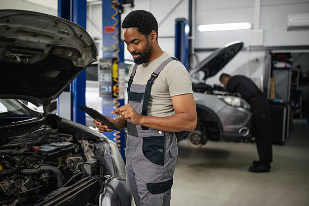 istock Automotive Technician Working with a Tablet in Garage 2218238251