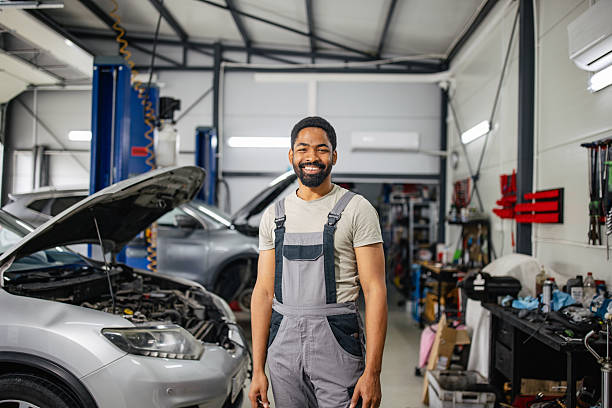 istock Smiling Mechanic in Auto Repair Workshop Environment 2218238850