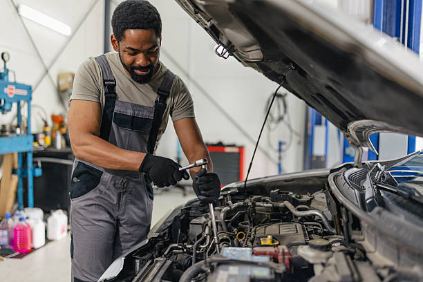 istock Mechanic tightening car engine bolts with tool 2218239654