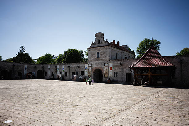Zbarazh, Ukraine - May 30, 2025: Open courtyard surrounded by medieval buildings showcasing traditional architecture and heritage