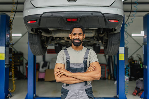 istock Confident mechanic proudly standing with arms crossed 2218241501