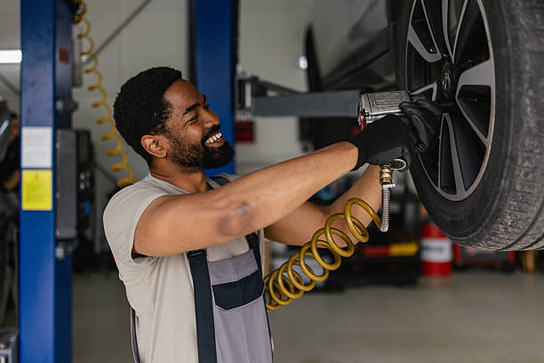 istock Mechanic using air tool to change a tire 2218241567