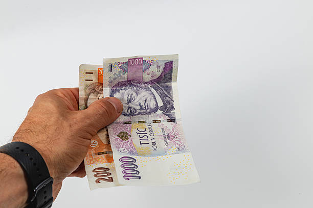 istock Holding various denominations of currency in hand 2218249733