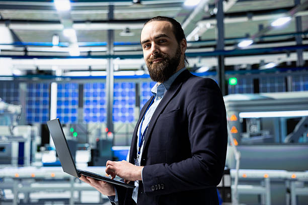 istock Solar panel industry expert stands in a high tech facility for inspection 2218252526