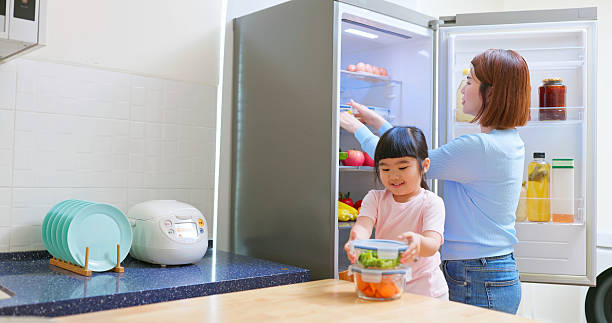 istock Asian mother educate kid kitchen 2218252615