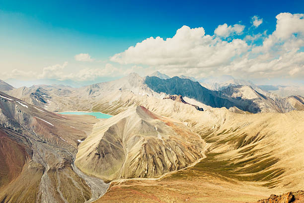 istock Aerial panoramic wide view Kelitsadi lake hiking trail through Khorisari pass. Keli volcanic plateau. Kazbegi national park 2218253233