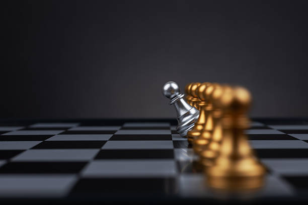 istock silver pawn chess on chess board move out from line for different thinking and leading change 2218258302