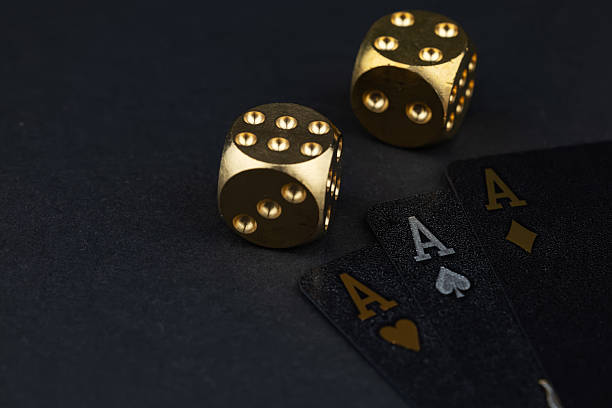 istock Playing cards and dices. Gambling concept. Dark background 2218259364