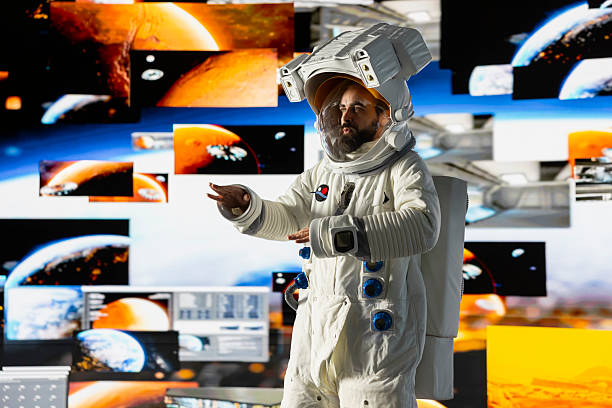 istock Young male cosmonaut drifting in zero gravity during a space walk 2218260892