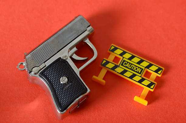 Man putting in or pulling out a gun of a gift bag