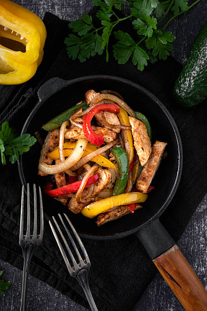 istock Chicken Fajitas on a rustic background 2218263395