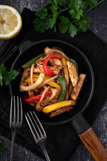 istock Chicken Fajitas on a rustic background 2218263397