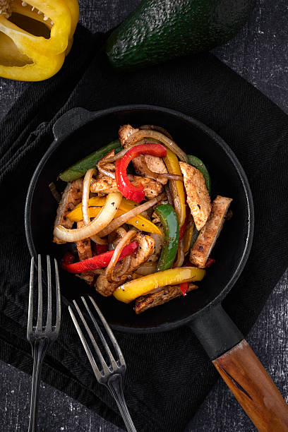istock Chicken Fajitas on a rustic background 2218263409
