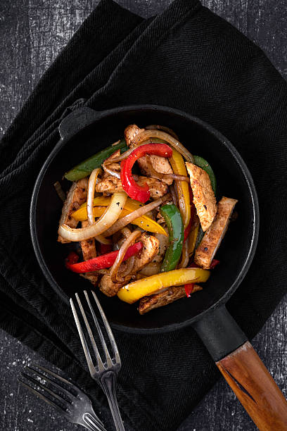 istock Chicken Fajitas on a rustic background 2218263411