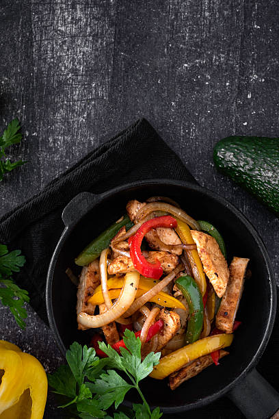istock Chicken Fajitas on a rustic background 2218263412