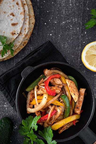 istock Chicken Fajitas on a rustic background 2218263431