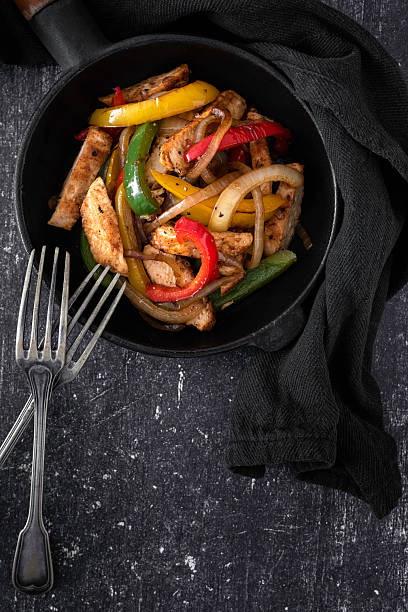 istock Chicken Fajitas on a rustic background 2218263439