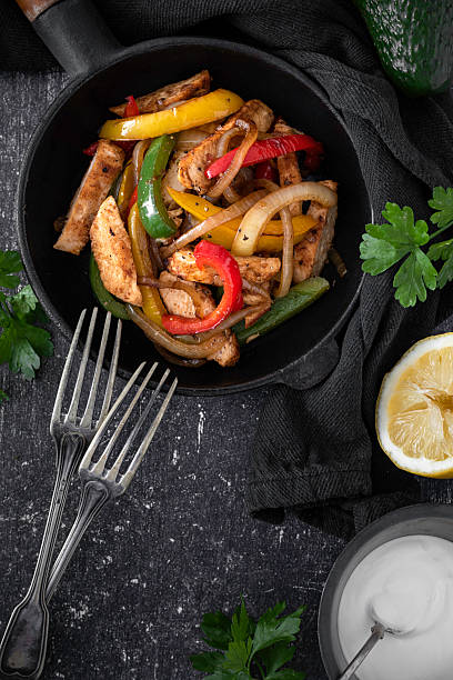 istock Chicken Fajitas on a rustic background 2218263456