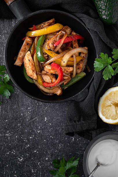 istock Chicken Fajitas on a rustic background 2218263457