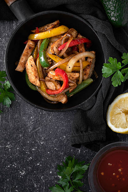 istock Chicken Fajitas on a rustic background 2218263460