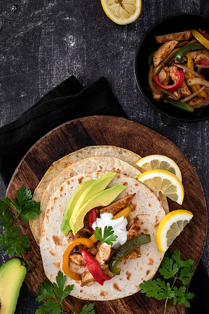 istock Chicken Fajitas on a rustic background 2218263576