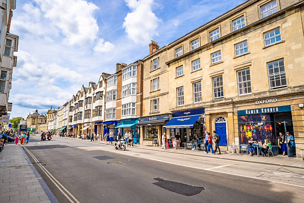 Oxford, UK. 31 May 2025. Shops and shoppers on the high street of Oxford