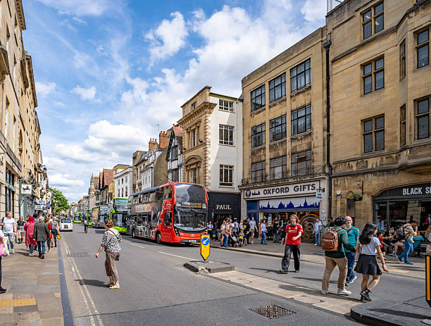 Oxford, UK. 31 May 2025. Shops and shoppers on the high street of Oxford