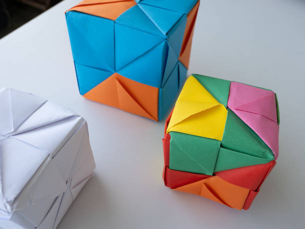 istock Colorful Origami Cubes on White Table 2218265893