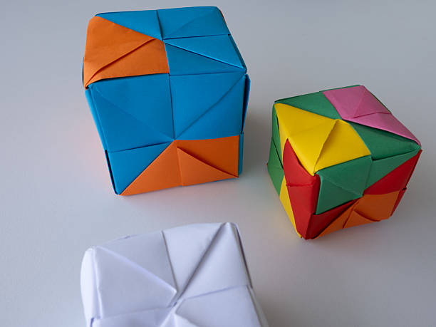 istock Colorful Origami Cubes on White Table 2218266021