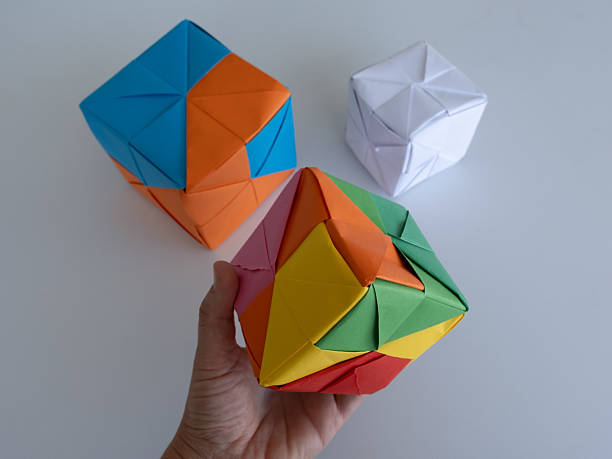 istock Colorful Origami Cubes on White Table 2218266127