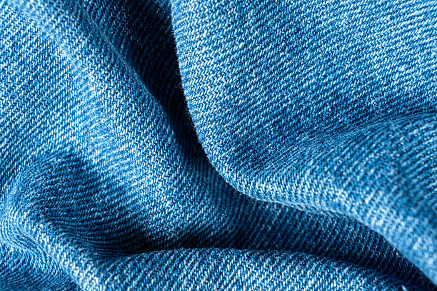istock Macro View of Wrinkled Denim Cloth with Shadows and Texture. 2218270874