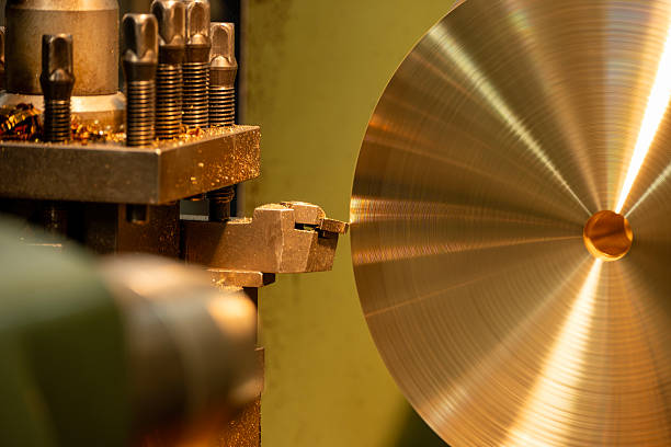 istock Close up scene the lathe machine finish cut the brass material parts by chip insert tool. 2218273018