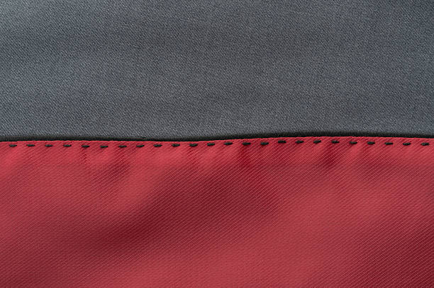 istock Fabric close-up showcasing gray and red textile with stitching details 2218276802