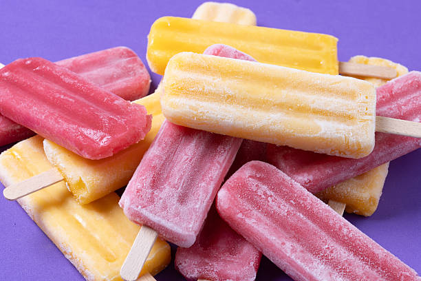 istock Red strawberry popsicles and yellow popsicles 2218276888